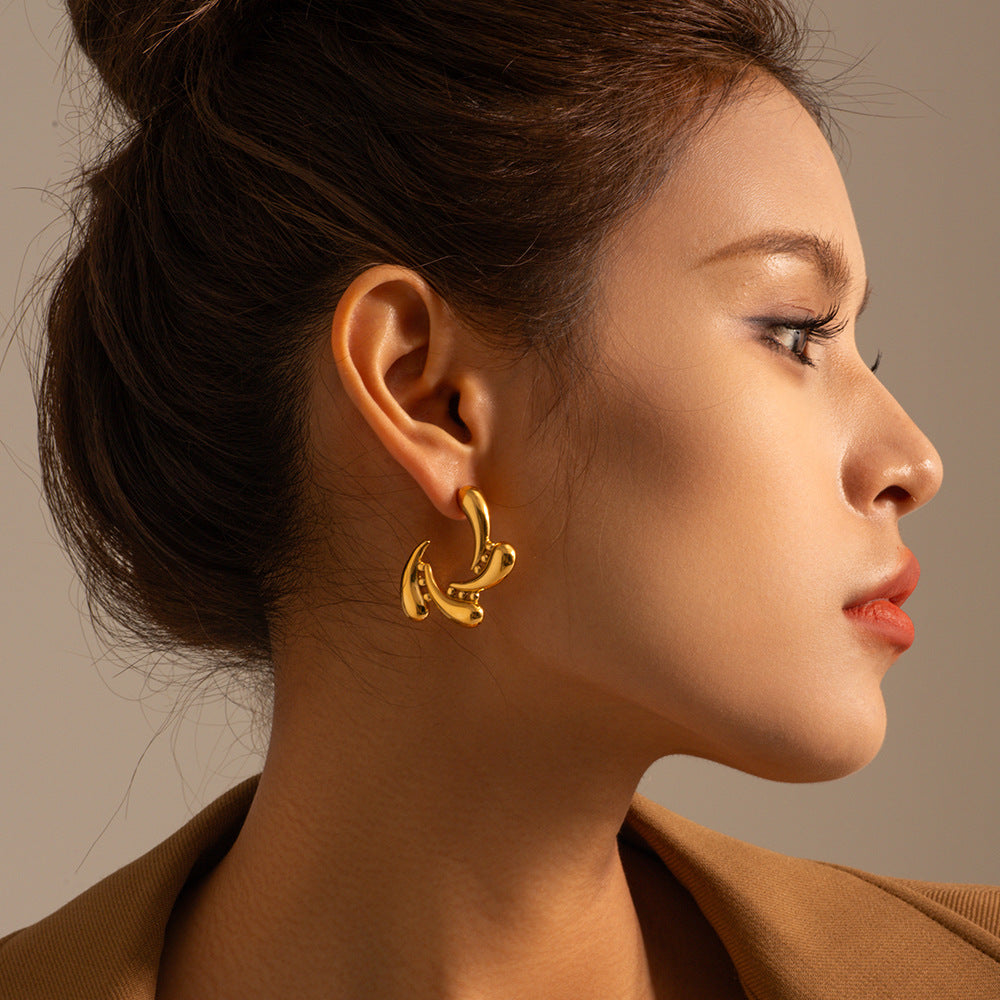 Gold Titanium Molten Steel Drops Rotate Earrings
